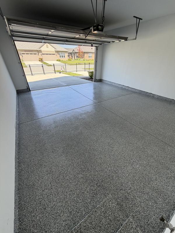 Gray flake epoxy garage floor coating in a residential two-car garage